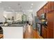 Modern kitchen showcasing custom cabinetry, granite countertops, stainless steel appliances, and hardwood flooring at 1258 Dekalb Ne Ave # 112, Atlanta, GA 30307