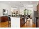 Open kitchen with granite countertops, stainless steel appliances, and a view into the living room at 1258 Dekalb Ne Ave # 112, Atlanta, GA 30307