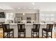Bright eat-in kitchen features stainless steel appliances, gray cabinets, pendant lights, and countertop dining at 1258 Dekalb Ne Ave # 112, Atlanta, GA 30307