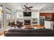 Spacious living area with a fireplace, built-in shelves, hardwood floors, and access to a charming outdoor balcony at 1258 Dekalb Ne Ave # 112, Atlanta, GA 30307