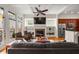 Open living room with fireplace and view to kitchen and balcony at 1258 Dekalb Ne Ave # 112, Atlanta, GA 30307