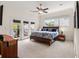 Bright main bedroom featuring a ceiling fan, balcony access, and a large window providing ample natural light at 1258 Dekalb Ne Ave # 112, Atlanta, GA 30307