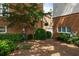 Backyard area with lots of shrubbery, mulch cover and street lamp at 1258 Dekalb Ne Ave # 112, Atlanta, GA 30307