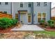 Concrete backyard patio with outdoor seating, lovely landscaping, and privacy fence at 2021 Towneship Trl, Roswell, GA 30075