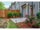 Backyard patio featuring lush landscaping, outdoor seating, and privacy fence at 2021 Towneship Trl, Roswell, GA 30075