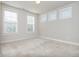 Neutral bedroom with three bright, sunny windows, and plush carpeting at 2021 Towneship Trl, Roswell, GA 30075