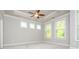 Bright and spacious bedroom with a tray ceiling and large windows at 2021 Towneship Trl, Roswell, GA 30075