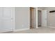 Bedroom with neutral walls, carpet flooring, and white doors at 2021 Towneship Trl, Roswell, GA 30075