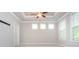 This bedroom is spacious with a tray ceiling, ceiling fan and neutral walls at 2021 Towneship Trl, Roswell, GA 30075