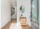Inviting foyer with hardwood floors, a console table, and a view of the staircase at 2021 Towneship Trl, Roswell, GA 30075