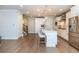 Spacious eat-in kitchen with stainless steel appliances, kitchen island, and beautiful hardwood floors at 2021 Towneship Trl, Roswell, GA 30075