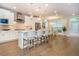 Open-concept kitchen with a large island, stainless steel appliances, and ample natural light at 2021 Towneship Trl, Roswell, GA 30075