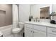 Updated bathroom features a shower with gray herringbone tile, a sleek vanity, and modern fixtures at 338 Sugarview Rd, Sugar Hill, GA 30518