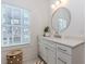 Well-lit bathroom featuring a modern vanity, large window, and stylish fixtures at 338 Sugarview Rd, Sugar Hill, GA 30518