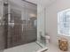 Chic bathroom with a glass-enclosed shower and stylish tile at 338 Sugarview Rd, Sugar Hill, GA 30518