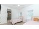 Comfortable bedroom with two twin beds, a modern ceiling fan, and an en suite bathroom at 338 Sugarview Rd, Sugar Hill, GA 30518