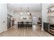 Bright kitchen with white cabinets, island with seating, stainless appliances, and modern design at 338 Sugarview Rd, Sugar Hill, GA 30518