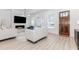 Cozy living room features a modern fireplace, large TV, and stylish decor for a relaxing atmosphere at 338 Sugarview Rd, Sugar Hill, GA 30518