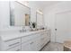 Elegant main bathroom with double vanities, stylish mirrors, and ample counter space at 338 Sugarview Rd, Sugar Hill, GA 30518