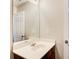 Clean bathroom vanity with a bright, large mirror and white counter at 3622 Utoy Dr, South Fulton, GA 30331
