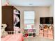 Bedroom featuring a crib, toys, and a window at 3622 Utoy Dr, South Fulton, GA 30331