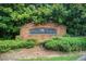 A brick sign for Cascade Cove is surrounded by lush, green landscaping creating a welcoming entrance to the neighborhood at 3622 Utoy Dr, South Fulton, GA 30331