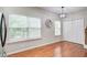 Dining room featuring ample natural light, hardwood floors, and modern lighting at 3622 Utoy Dr, South Fulton, GA 30331
