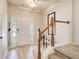Bright foyer with hardwood floors, staircase with carpeted steps, and natural light streaming in at 3622 Utoy Dr, South Fulton, GA 30331