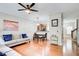 Cozy living room with hardwood floors, modern lighting, and open access to kitchen at 3622 Utoy Dr, South Fulton, GA 30331