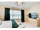 Main bedroom with vaulted ceilings, carpet, and large window with privacy blinds at 3622 Utoy Dr, South Fulton, GA 30331