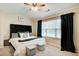 Bedroom featuring a ceiling fan, natural light and black drapes at 3622 Utoy Dr, South Fulton, GA 30331