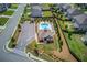 Aerial view of the community pool, highlighting the lounge area, parking, and surrounding residential area at 4931 Pauls Pointe, Sugar Hill, GA 30518