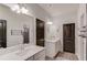 Bright, modern bathroom with dual sinks, mirrors, and stylish fixtures at 4931 Pauls Pointe, Sugar Hill, GA 30518