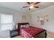 A comfortable bedroom with natural light and cozy furnishings at 4931 Pauls Pointe, Sugar Hill, GA 30518