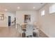 Well-lit dining room with hardwood floors, a round table and art on the walls at 4931 Pauls Pointe, Sugar Hill, GA 30518