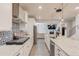 Modern kitchen with granite countertops, stainless steel appliances, and an open layout at 4931 Pauls Pointe, Sugar Hill, GA 30518