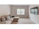 Comfortable living room with sectional couch, tv and carpeted floors at 4931 Pauls Pointe, Sugar Hill, GA 30518