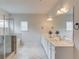 Beautiful main bathroom with walk-in glass shower and double sinks and vanity at 4931 Pauls Pointe, Sugar Hill, GA 30518