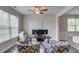 A Home office featuring dual monitors, windows with blinds, and designer accent chairs at 4931 Pauls Pointe, Sugar Hill, GA 30518