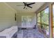 Inviting screened porch with white couch and backyard views at 4931 Pauls Pointe, Sugar Hill, GA 30518