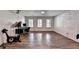 Finished basement with wood floors features a home theater, exercise equipment, and space for an office at 1901 Paper Birch Cv, Grayson, GA 30017