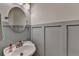 Neutral bathroom with a white sink, a round mirror and light gray walls at 1901 Paper Birch Cv, Grayson, GA 30017