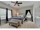 Charming bedroom with a cozy bed, stylish furnishings, and windows with natural light at 1901 Paper Birch Cv, Grayson, GA 30017