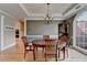 Charming dining room boasts hardwood floors, a chandelier, and lots of natural light at 1901 Paper Birch Cv, Grayson, GA 30017