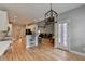 Eat-in kitchen with white cabinets, bar seating, and an open layout perfect for gathering at 1901 Paper Birch Cv, Grayson, GA 30017