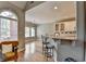 Modern kitchen features granite countertops, breakfast bar, and a seamless connection to the living area at 1901 Paper Birch Cv, Grayson, GA 30017