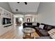 Bright living room featuring hardwood floors, built-in shelves, and seamless flow to the dining area at 1901 Paper Birch Cv, Grayson, GA 30017