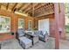 Cozy covered patio with comfortable seating perfect for relaxation and outdoor enjoyment and entertaining at 1901 Paper Birch Cv, Grayson, GA 30017