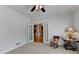 Spacious room featuring neutral carpet, white trim, and double French doors at 1901 Paper Birch Cv, Grayson, GA 30017
