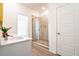 Bathroom featuring a vanity with a sink and modern finishes, along with a walk-in shower at 2106 Remy Ct, Kennesaw, GA 30144